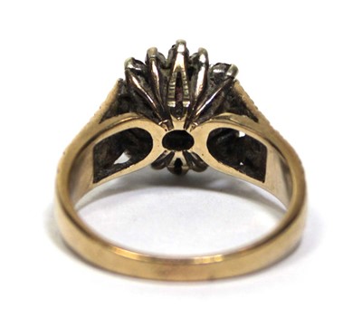 Lot 687 - A 9ct yellow gold cluster ring set oval garnet...