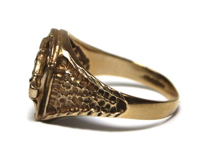 Lot 689 - A 9ct yellow gold ring modelled as a horses...