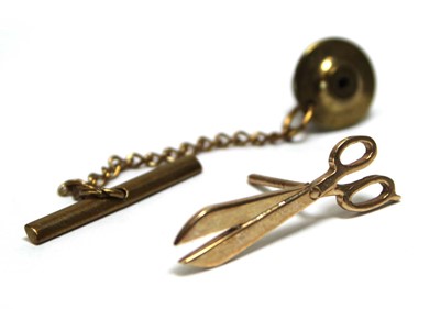 Lot 694 - A 9ct yellow gold pin in the form of a pair of...