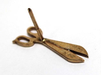 Lot 694 - A 9ct yellow gold pin in the form of a pair of...