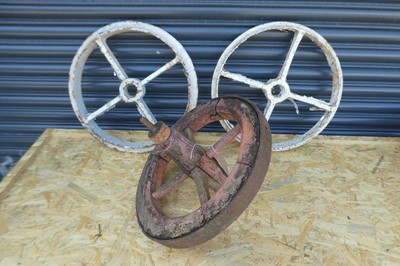 Lot 2 Cast iron wheels together with 1 woodenmetal...