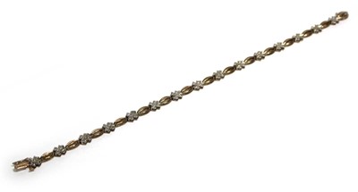 Lot 696 - A 9ct yellow gold tennis-type bracelet set...