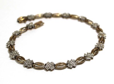 Lot 696 - A 9ct yellow gold tennis-type bracelet set...