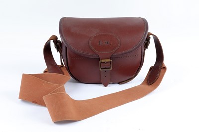 Lot 48 - A leather cartridge bag with canvas strap