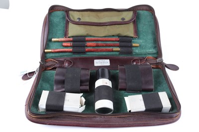 Lot 1142 - William & Son shotgun cleaning kit in leather...