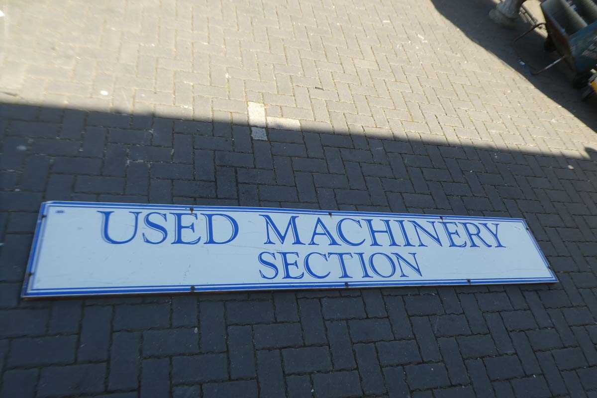 Lot Large advertisement sign "USED MACHINERY SECTION"