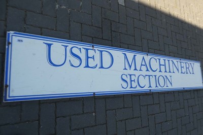 Lot Large advertisement sign "USED MACHINERY SECTION"