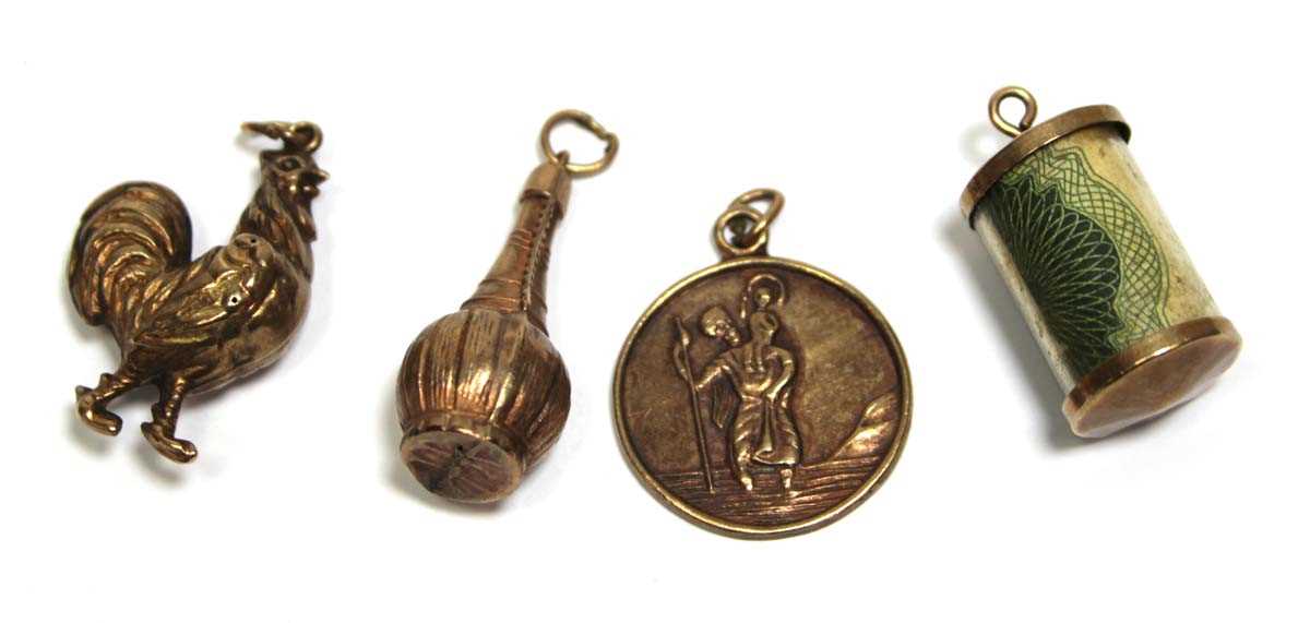 Lot 700 - Four 9ct yellow gold charms including a...