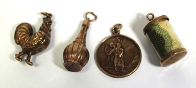 Lot 700 - Four 9ct yellow gold charms including a...