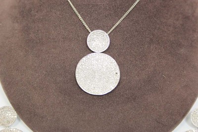 Lot 702 - A 9ct white gold flat curblink necklace...
