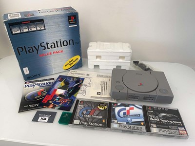Lot 1176 - Sony PlayStation in box together with 3x games...