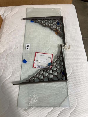 Lot 1026 - Single glass shelf with pair of cast metal...