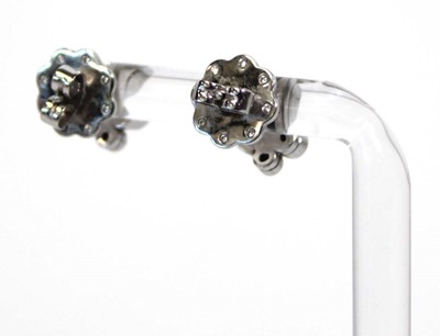 Lot 703 - A pair of platinium and diamond set 'Raindance'...