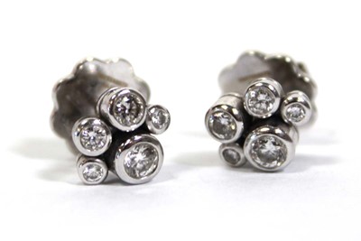 Lot 703 - A pair of platinium and diamond set 'Raindance'...
