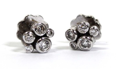 Lot 703 - A pair of platinium and diamond set 'Raindance'...