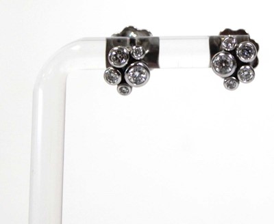 Lot 703 - A pair of platinium and diamond set 'Raindance'...