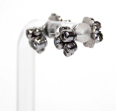Lot 703 - A pair of platinium and diamond set 'Raindance'...