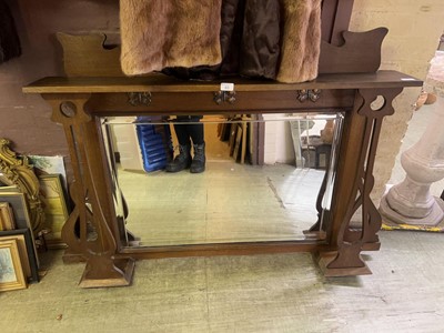 Lot 71 - A large oak framed over mantle mirror with...