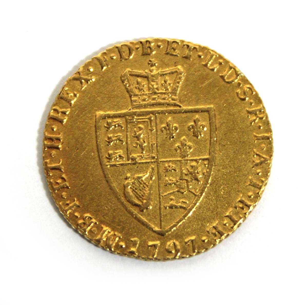 Lot 404 - A George III spade half guinea dated 1797