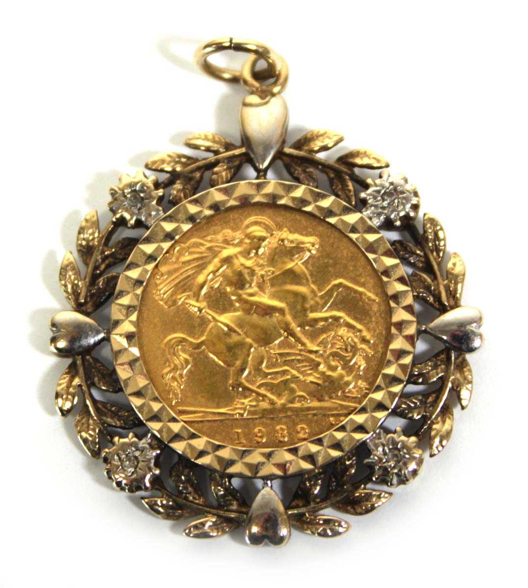 Lot 409 - A yellow metal pendant set small diamonds and...