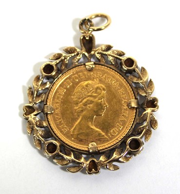 Lot 409 - A yellow metal pendant set small diamonds and...