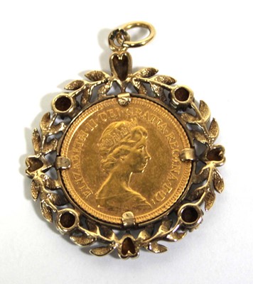 Lot 409 - A yellow metal pendant set small diamonds and...