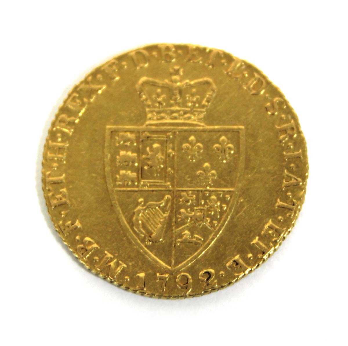 Lot 410 - A George III spade guinea dated 1792