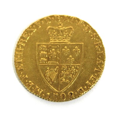 Lot 410 - A George III spade guinea dated 1792