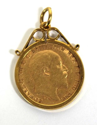 Lot 415 - A 9ct yellow gold pendant set half sovereign...