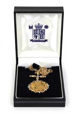 Lot 420 - A Royal Mint 14ct yellow gold pendant necklace...