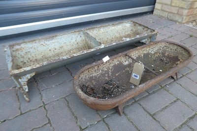 Lot A weathered cast iron two sectioned feeding...