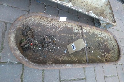 Lot A weathered cast iron two sectioned feeding...