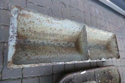 Lot A weathered cast iron two sectioned feeding...