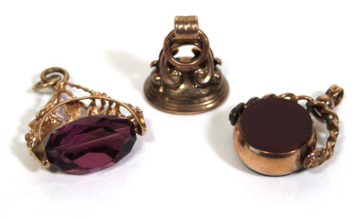 Lot 709 - A pair of 9ct yellow gold fobs including a...