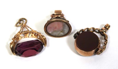 Lot 709 - A pair of 9ct yellow gold fobs including a...