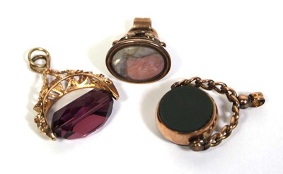 Lot 709 - A pair of 9ct yellow gold fobs including a...