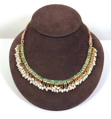 Lot 710 - An Indian cord and yellow gold necklace...