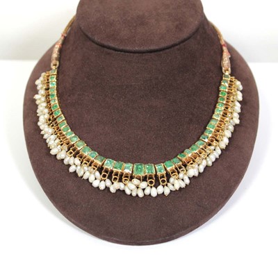 Lot 710 - An Indian cord and yellow gold necklace...