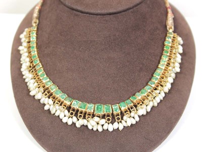 Lot 710 - An Indian cord and yellow gold necklace...