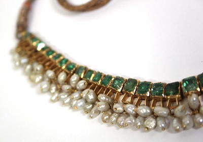 Lot 710 - An Indian cord and yellow gold necklace...