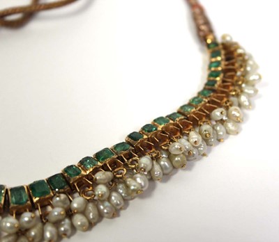 Lot 710 - An Indian cord and yellow gold necklace...