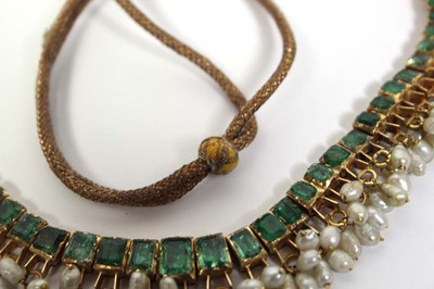 Lot 710 - An Indian cord and yellow gold necklace...