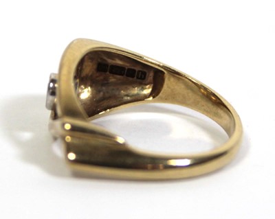 Lot 714 - A 9ct yellow gold ring set diamond in an...