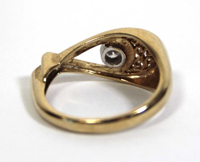 Lot 714 - A 9ct yellow gold ring set diamond in an...