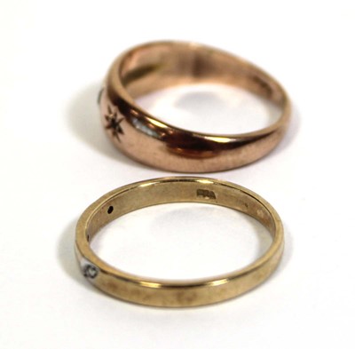 Lot 715 - A 9ct yellow gold ring set three small...