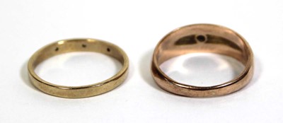 Lot 715 - A 9ct yellow gold ring set three small...