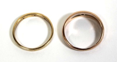 Lot 715 - A 9ct yellow gold ring set three small...