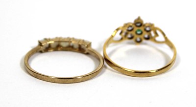 Lot 717 - A 9ct yellow gold ring set five small opals in...