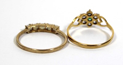 Lot 717 - A 9ct yellow gold ring set five small opals in...