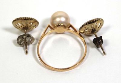 Lot 719 - A pair of 9ct yellow gold ear studs, each set...